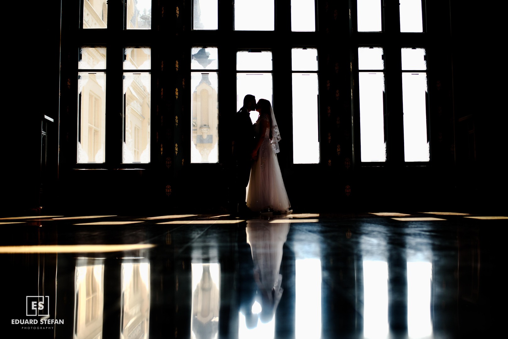 Bride smiling with bouquet in hand